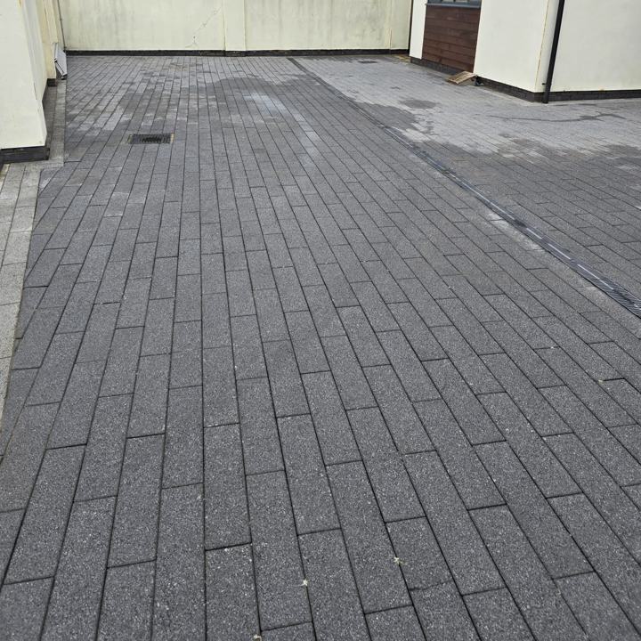 The same grey paving after cleaning, even in colour